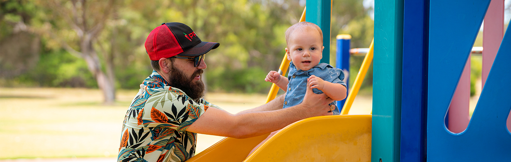 Image of family playing on slide